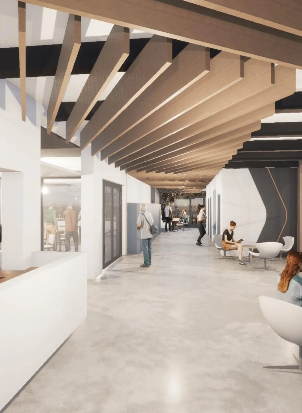 A bright, spacious hallway with wood and white accents. People are walking and sitting, some near a reception desk.  Large windows overlook a basketball court.